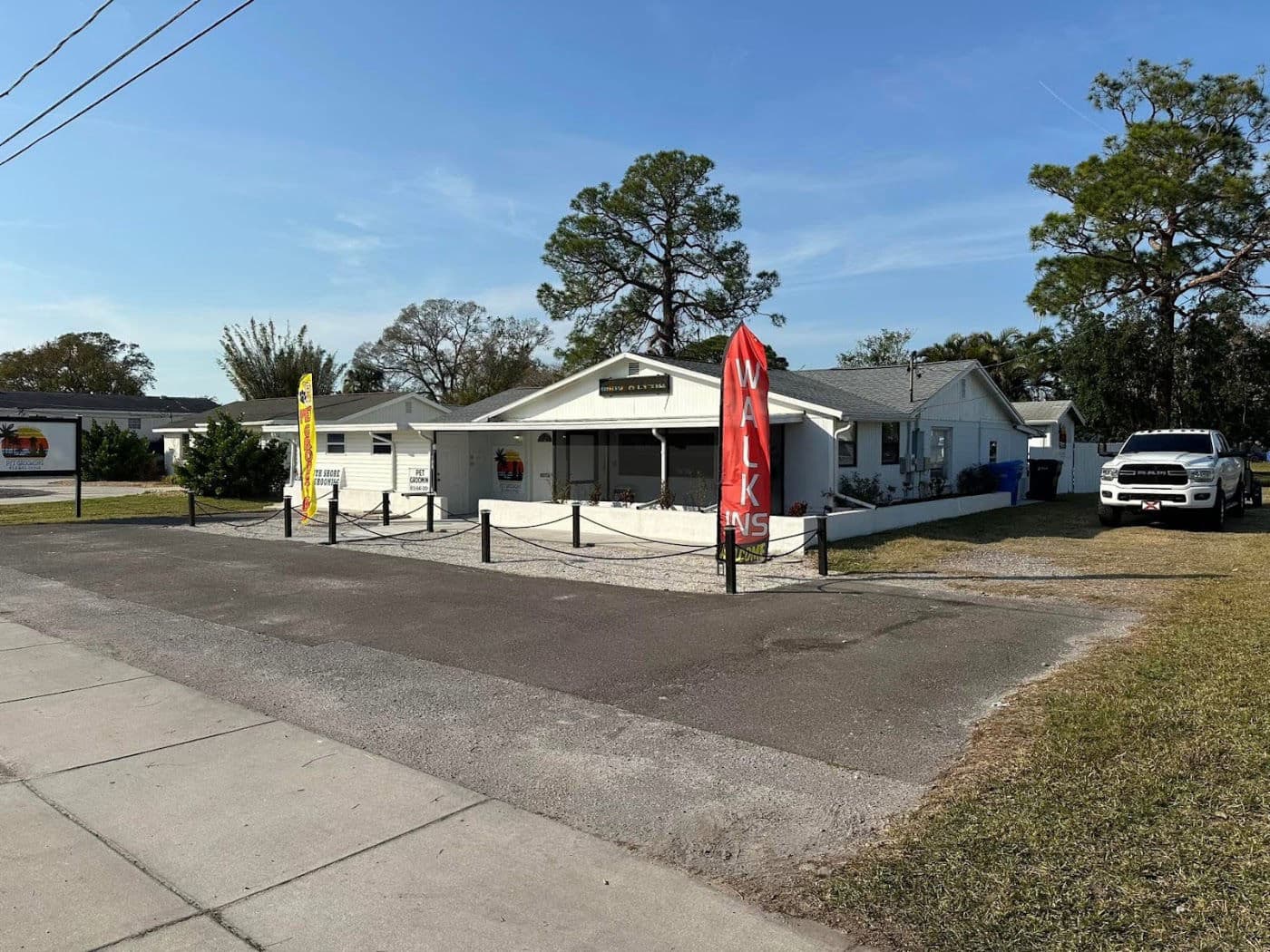Southshore Pet Grooming salon storefront at 201 W Shell Point Rd, Ruskin FL, walk-ins welcome flag out front